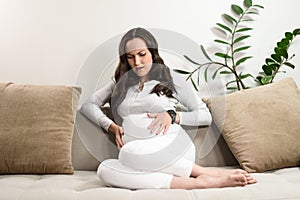 Pregnant woman experiences pain, abdominal discomfort, labor pains, birth pangs
