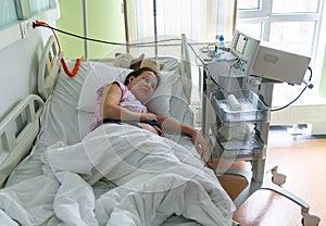 Pregnant woman feels hard contraction in a hospital labor delivery room. Concept photo of pregnancy, pregnant woman