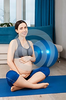 Pregnant woman with fit ball