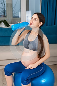 Pregnant woman on fit ball