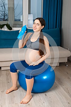 Pregnant woman on fit ball