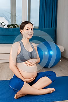 Pregnant woman with fit ball