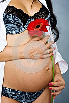 Pregnant woman with flower