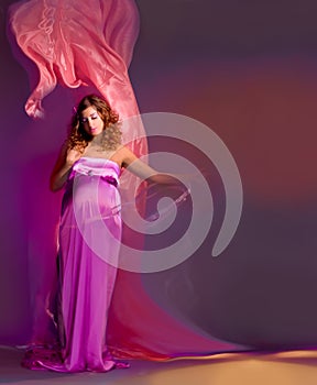Pregnant woman in flying fabric