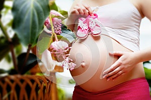 Pregnant woman in garden