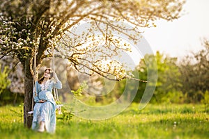 Pregnant woman in the garden