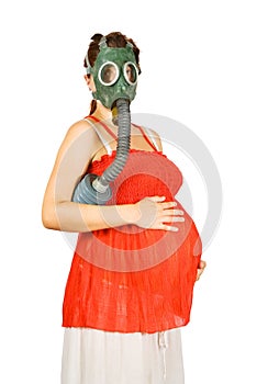 Pregnant woman in gas-mask holding belly