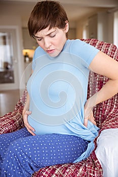 Pregnant woman getting a contraction photo