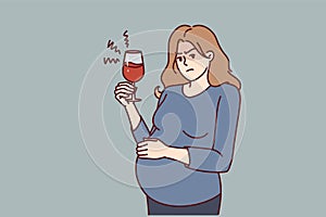 Pregnant woman with glass of wine drinks alcohol unknowingly causing harm to unborn child