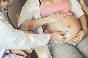 Pregnant woman and gynaecologist doctor at hospital