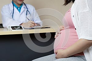 Pregnant Woman and Gynecologist Doctor at Hospital