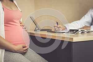 Pregnant Woman and Gynecologist Doctor at Hospital