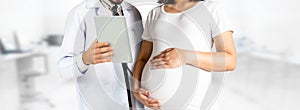 Pregnant Woman and Gynecologist Doctor at Hospital