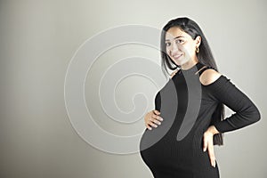 pregnant woman hand on the belly