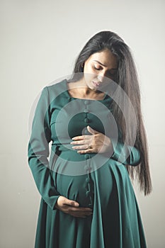 pregnant woman hand on the belly