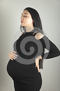 pregnant woman hand on the belly