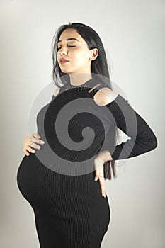 pregnant woman hand on the belly