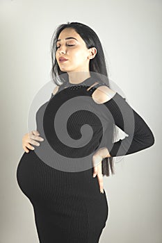 pregnant woman hand on the belly