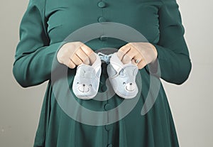 pregnant woman hand shoes