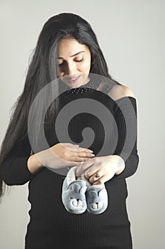 pregnant woman hand shoes