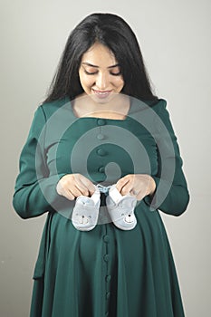 pregnant woman hand shoes