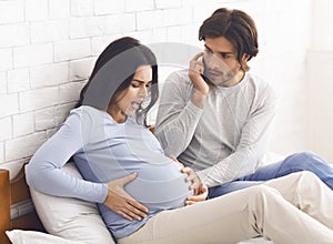 Pregnant Woman Having Contractions, Her Panicked Husband Calling Doctor