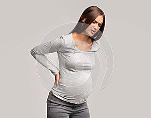 Pregnant Woman Having Lower Back Pain, Studio Shot