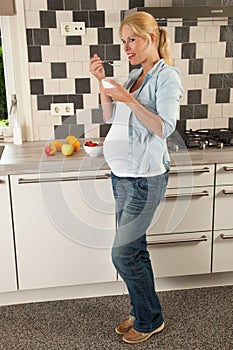 Pregnant woman having lunch