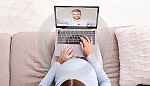 Pregnant woman having video conference with her husband