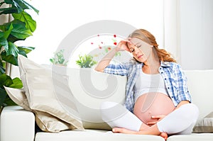 Pregnant woman with headache and pain