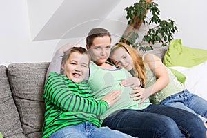 Pregnant woman with her children