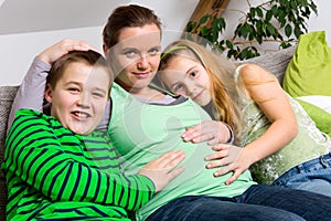 Pregnant woman with her children