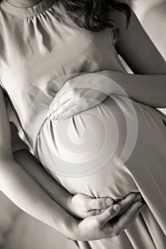 Pregnant woman with her husband, closeup.