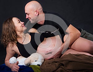 The pregnant woman with her husband love, care