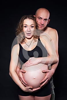 The pregnant woman with her husband love, care