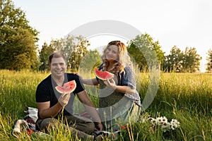 Pregnant woman with her husband on a picnic