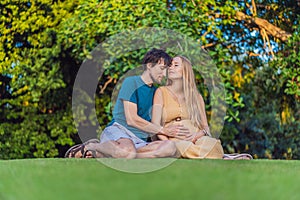 Pregnant woman and her husband spend quality time together outdoors, savoring each other& x27;s company and enjoying the