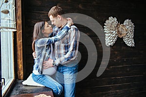 Pregnant woman with her husband waiting for newborn