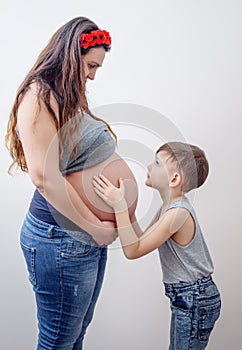 Pregnant woman beside her young child