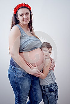 Pregnant woman beside her young child