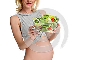 Pregnant woman hold organic salad. Pregnancy motherhood expectation healthy eating