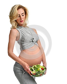 Pregnant woman hold organic salad. Pregnancy motherhood expectation healthy eating