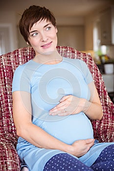 Pregnant woman holding her bump