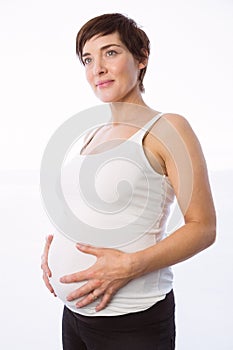 Pregnant woman holding her bump