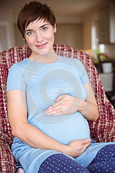 Pregnant woman holding her bump