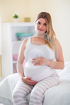 Pregnant woman holding her bump