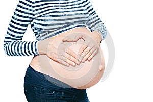 Pregnant Woman Holding her Hands in a Heart Shape