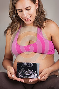 Pregnant Woman Holding Ultrasound