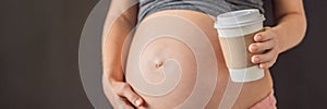 A pregnant woman holds a cup of coffee in her hands. Caffeine safety, myths about coffee during pregnancy concept BANNER