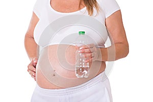 Pregnant woman holds a water bottle in her hand
